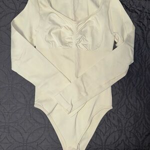 Elegant Cream Long Sleeve Bodysuit